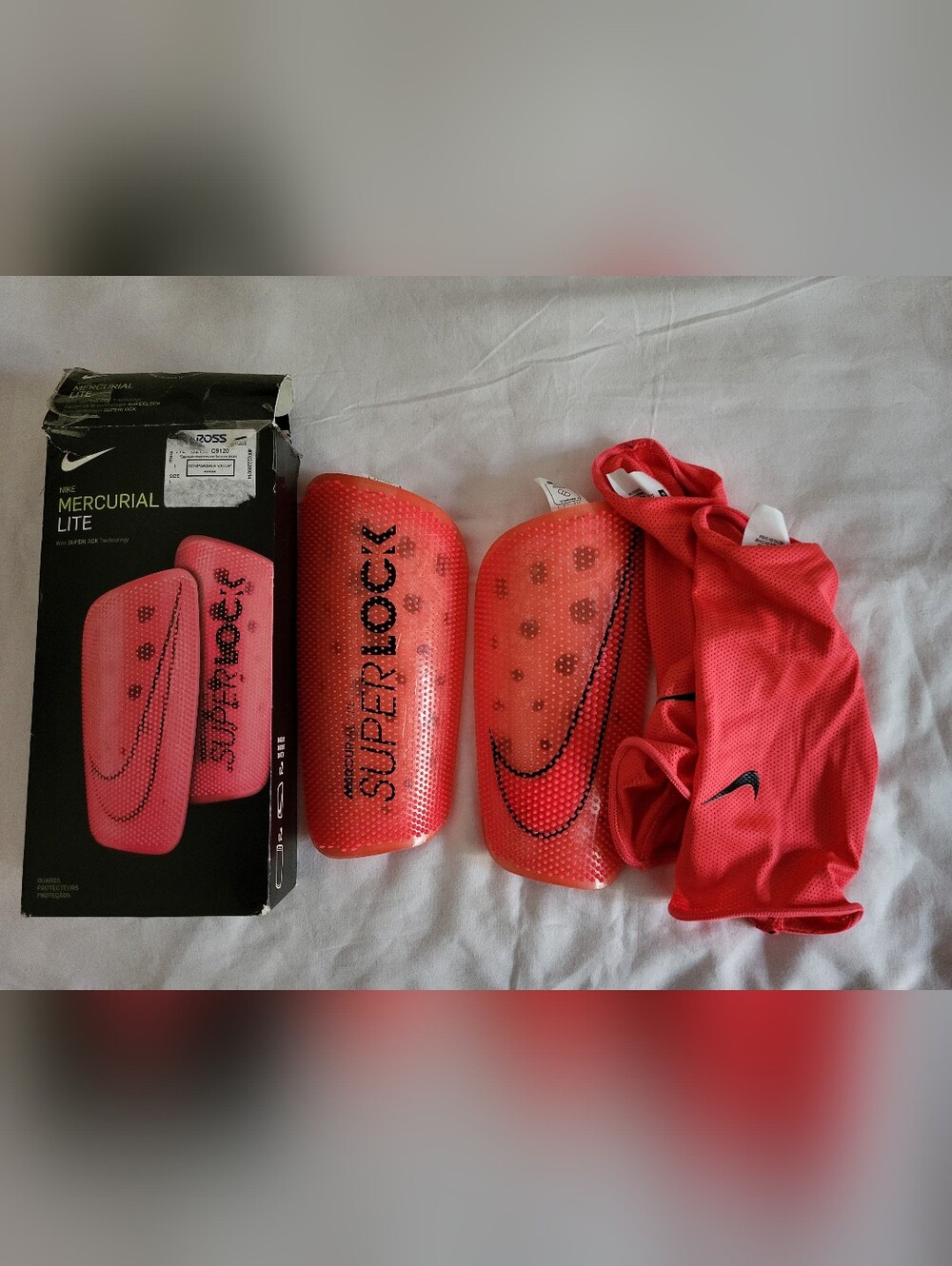 Nike Red Superlock Soccer Shin Guards with Black Logo